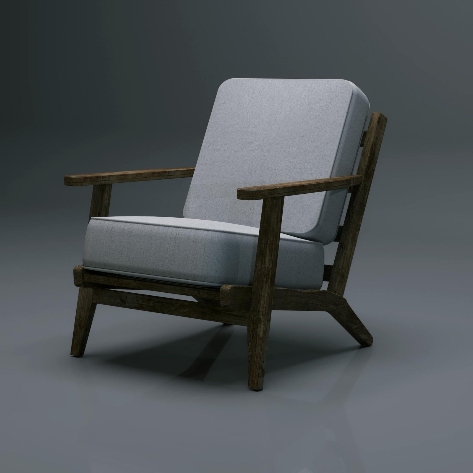 Minimalist wooden chair with gray upholstery on a studio backdrop.